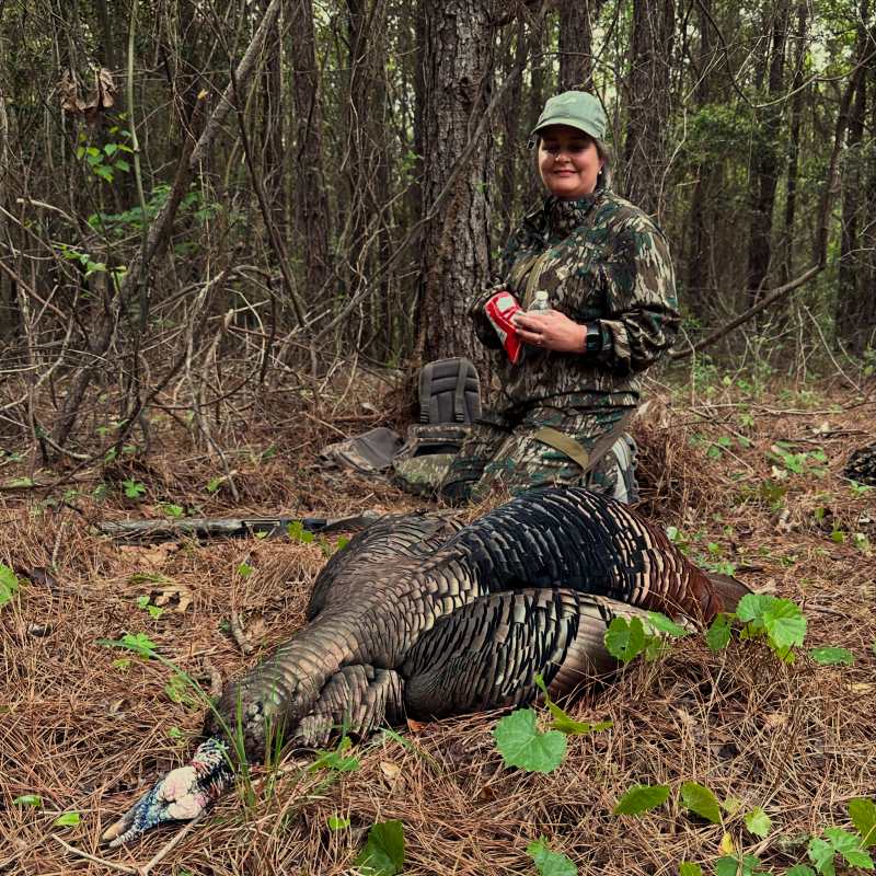 Summer from Houndstooth Game Calls poses with her turkey 